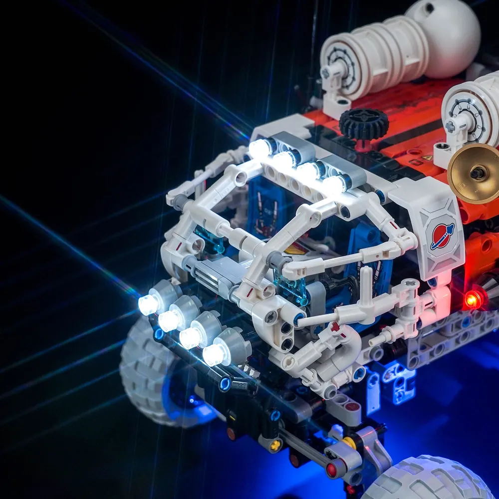 Close-up of BrickBling modular micro-LEDs and wiring harness on LEGO Technic rover chassis