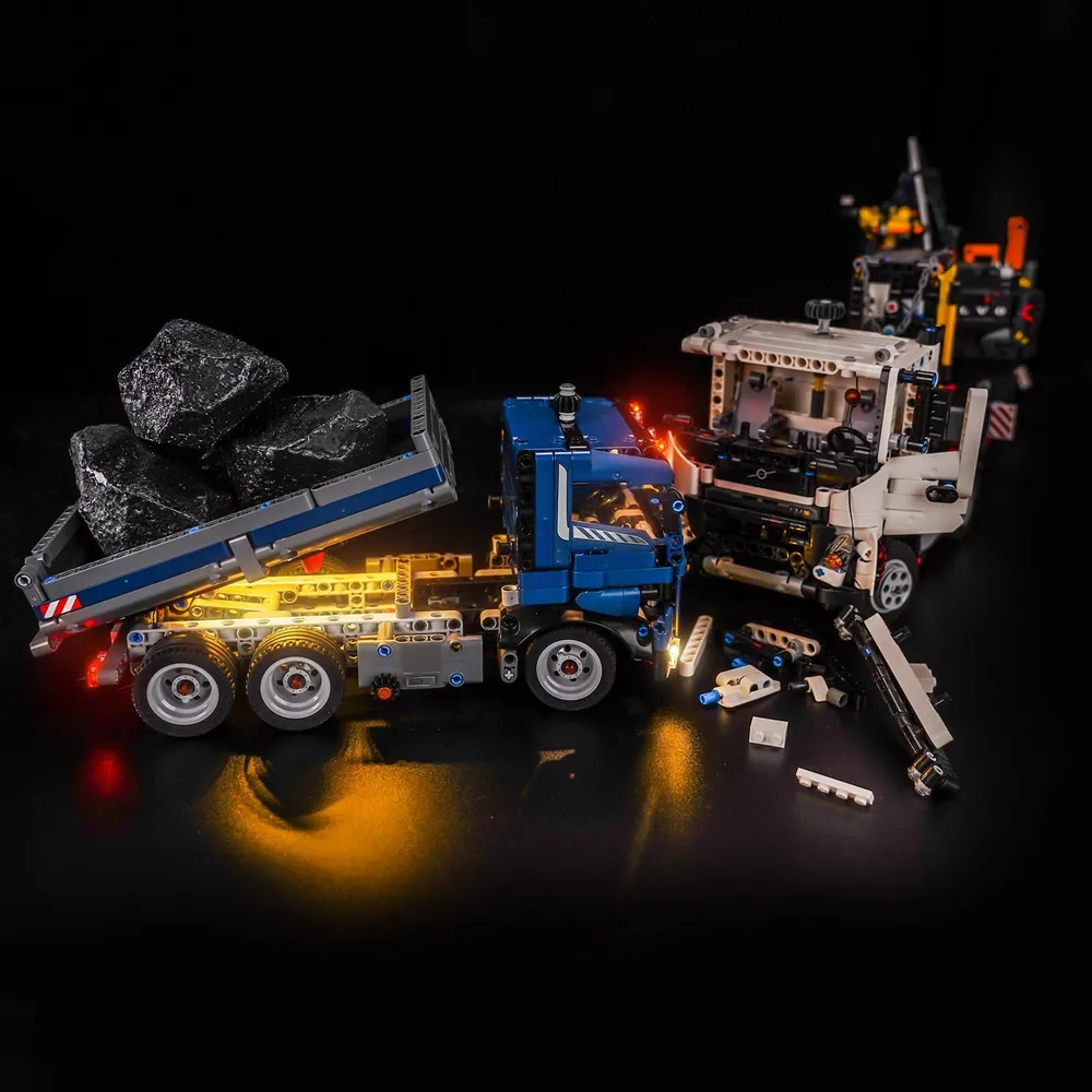 LEGO Tipping Dump Truck 42203 with BrickBling light kit in a dark room showing ambient lighting