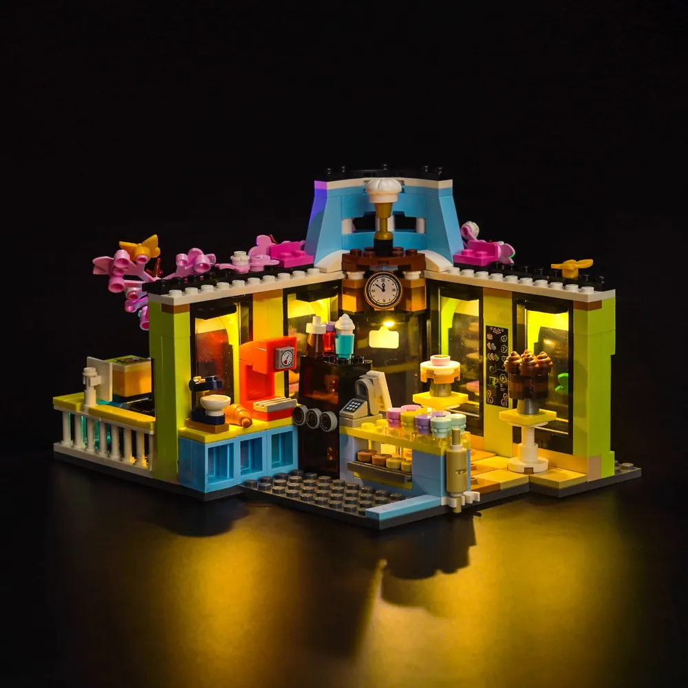 BrickBling light kit enhancing the street-facing awning of LEGO Friends Café 42618
