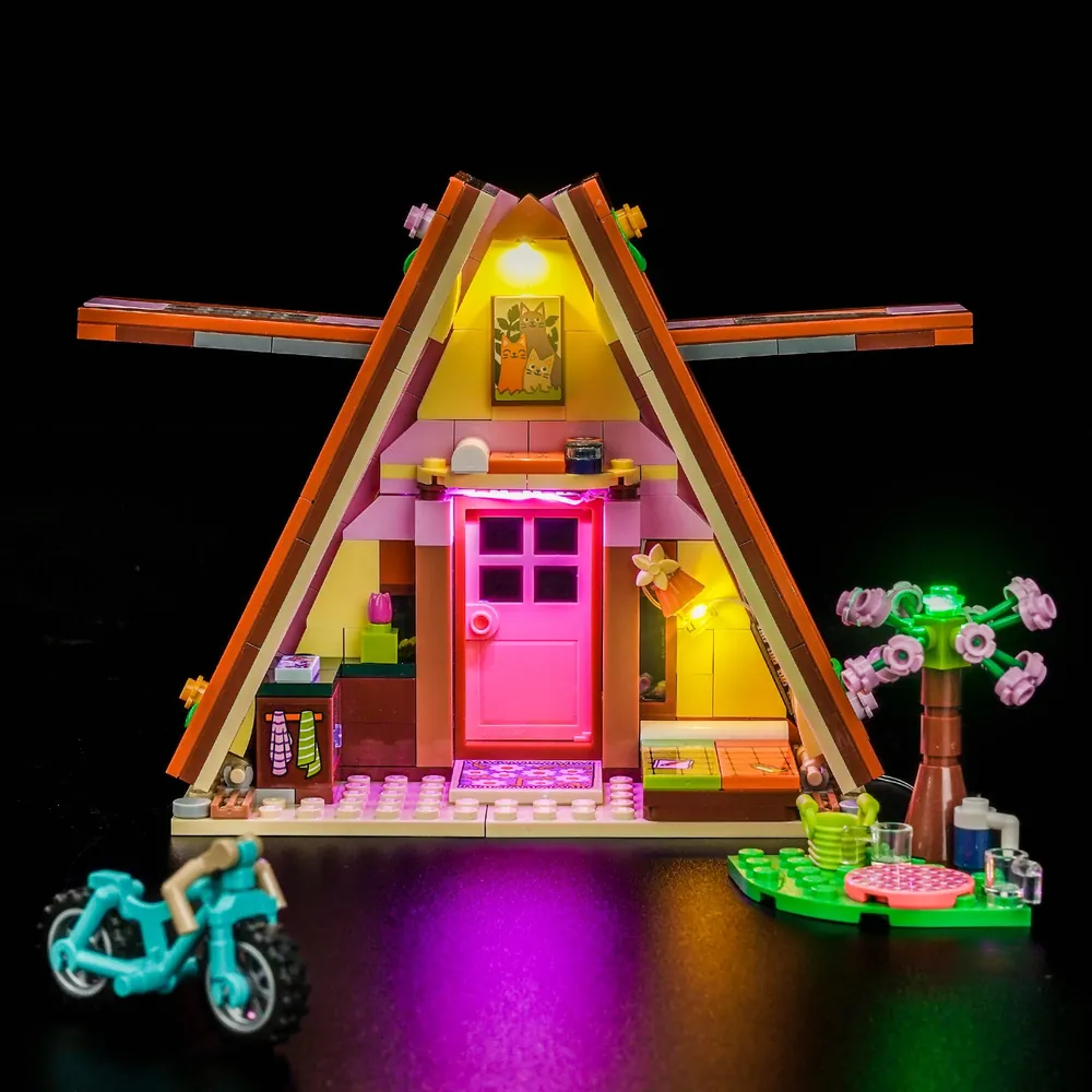 The LEGO Friends Glamping Cabin 42682 fully lit by BrickBling kit at night