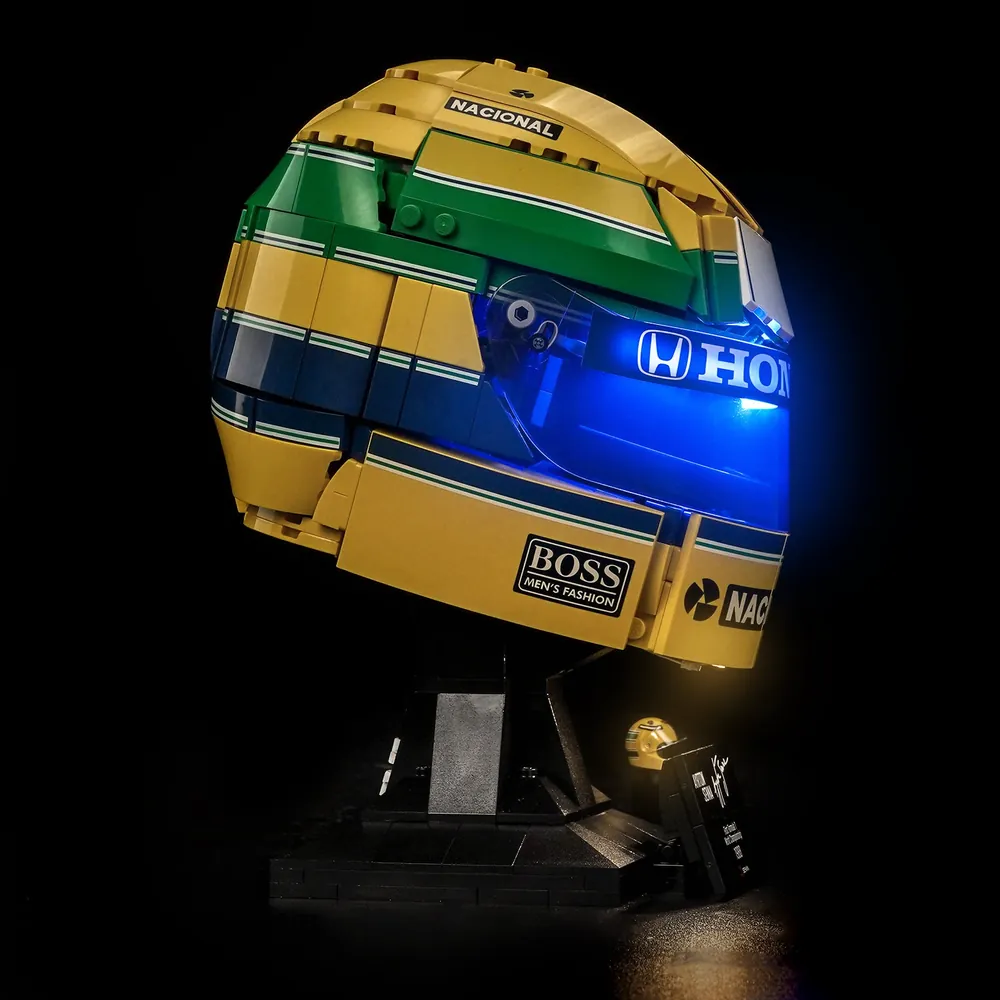Display-ready LEGO Senna Helmet 43024 with BrickBling lighting, showcasing the famous livery at night
