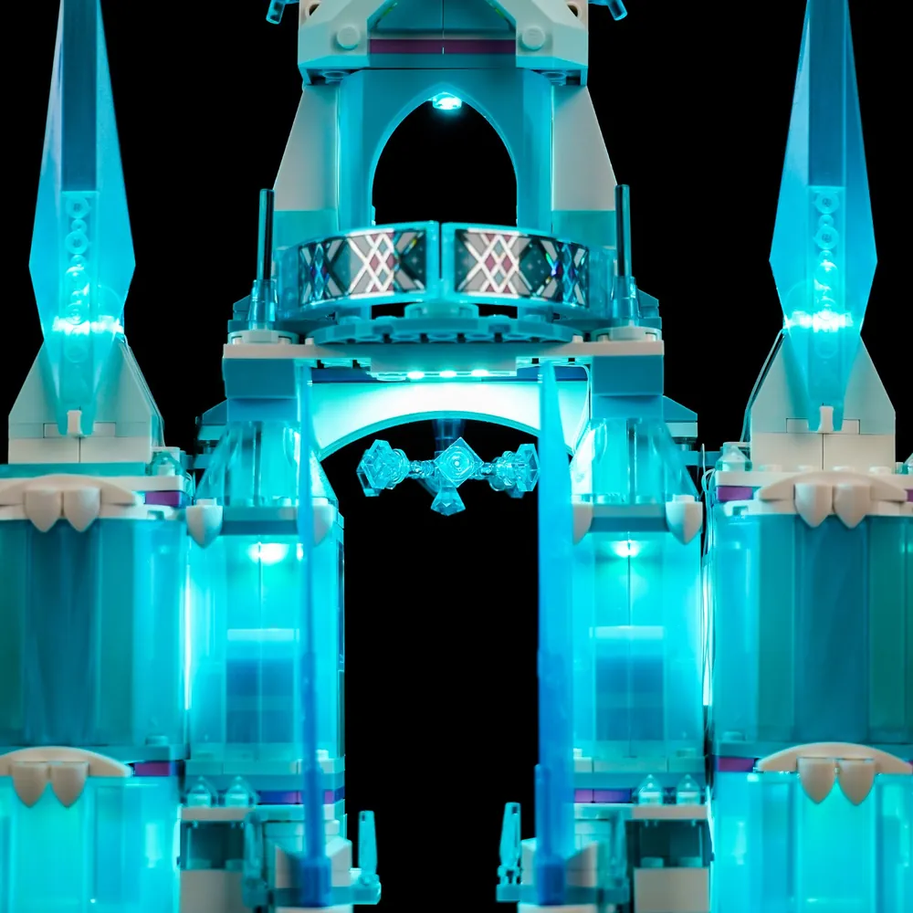 LEGO Elsa's Ice Palace illuminated with warm interior glow from BrickBling kit