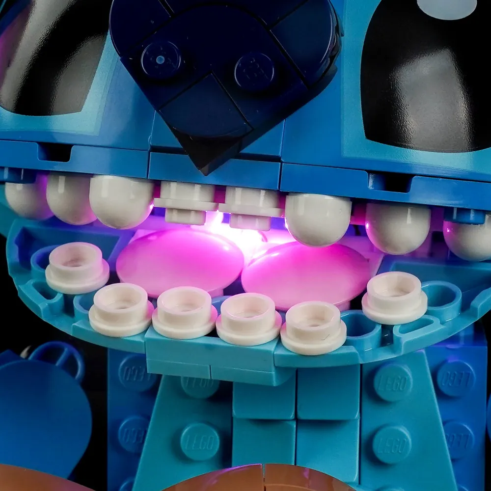 Close-up of BrickBling modular micro-LEDs on Stitch's face showing glowing eyes