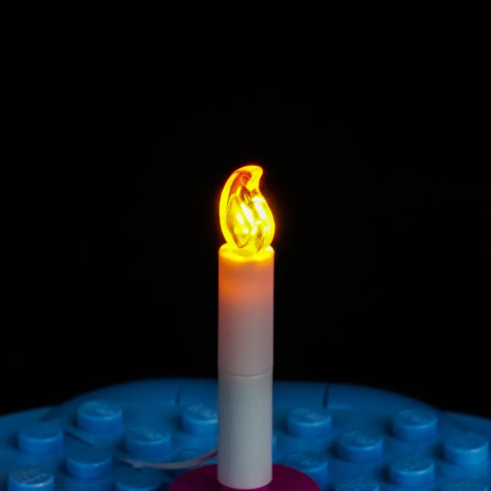 Close-up of modular micro-LEDs hidden among tan and pink bricks in LEGO 43305