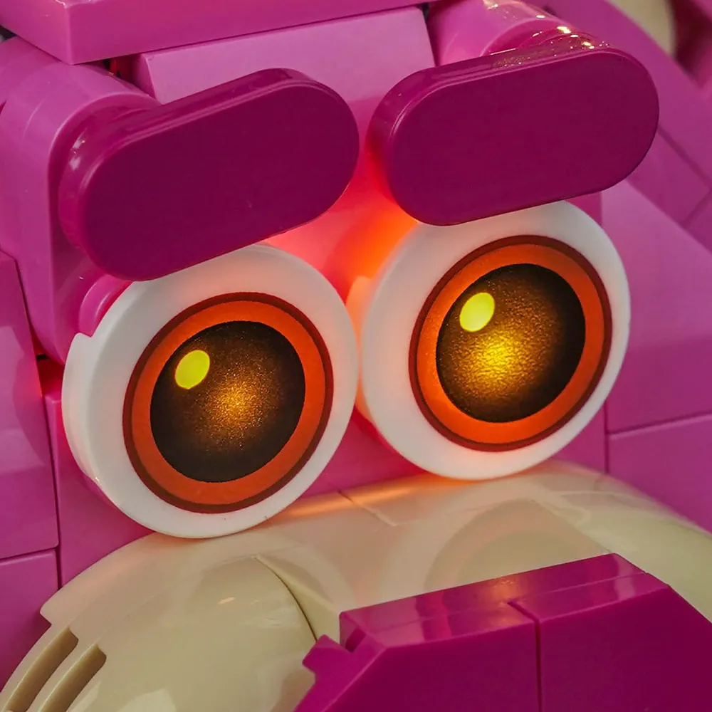 Modular micro-wires hidden under LEGO Lotso's base with warm illumination