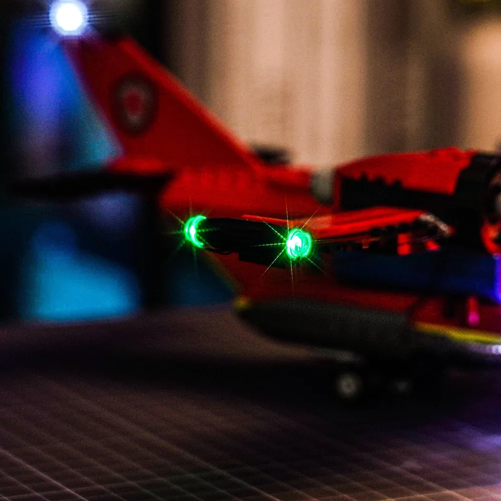 LEGO City Fire Rescue Plane display with lights on at night