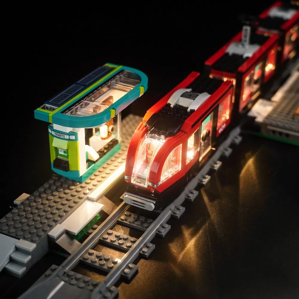 LEGO 60423 station with BrickBling lights on, highlighting windows and signage