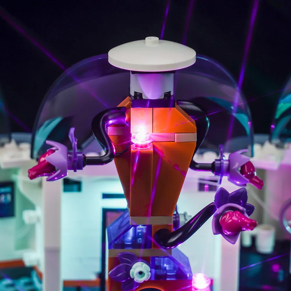 Close-up of BrickBling LED kit installation on LEGO Space Science Lab 60439 showing modular wiring