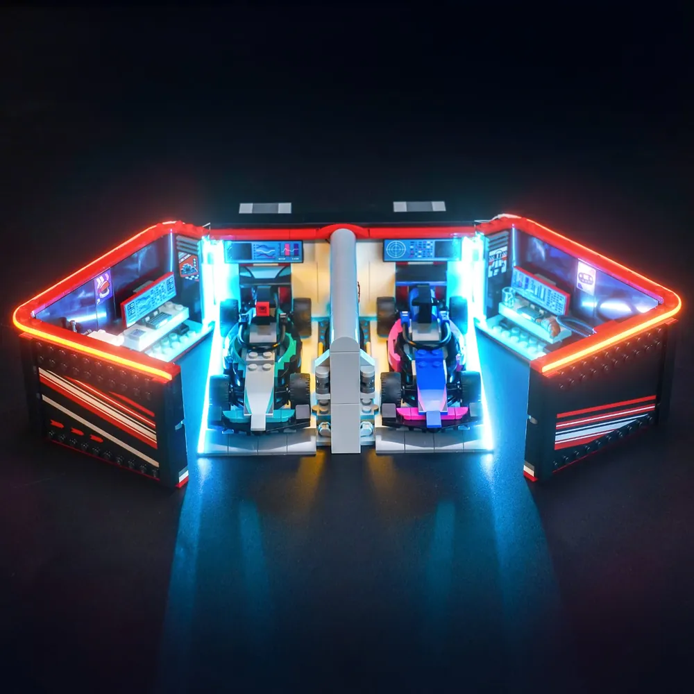 BrickBling LED kit for LEGO F1 Garage 60444 showcasing clean micro-LED lighting on Mercedes and Alpine cars