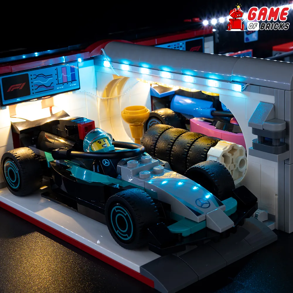 LEGO F1 Garage lit by Game of Bricks LED kit showing garage and cars