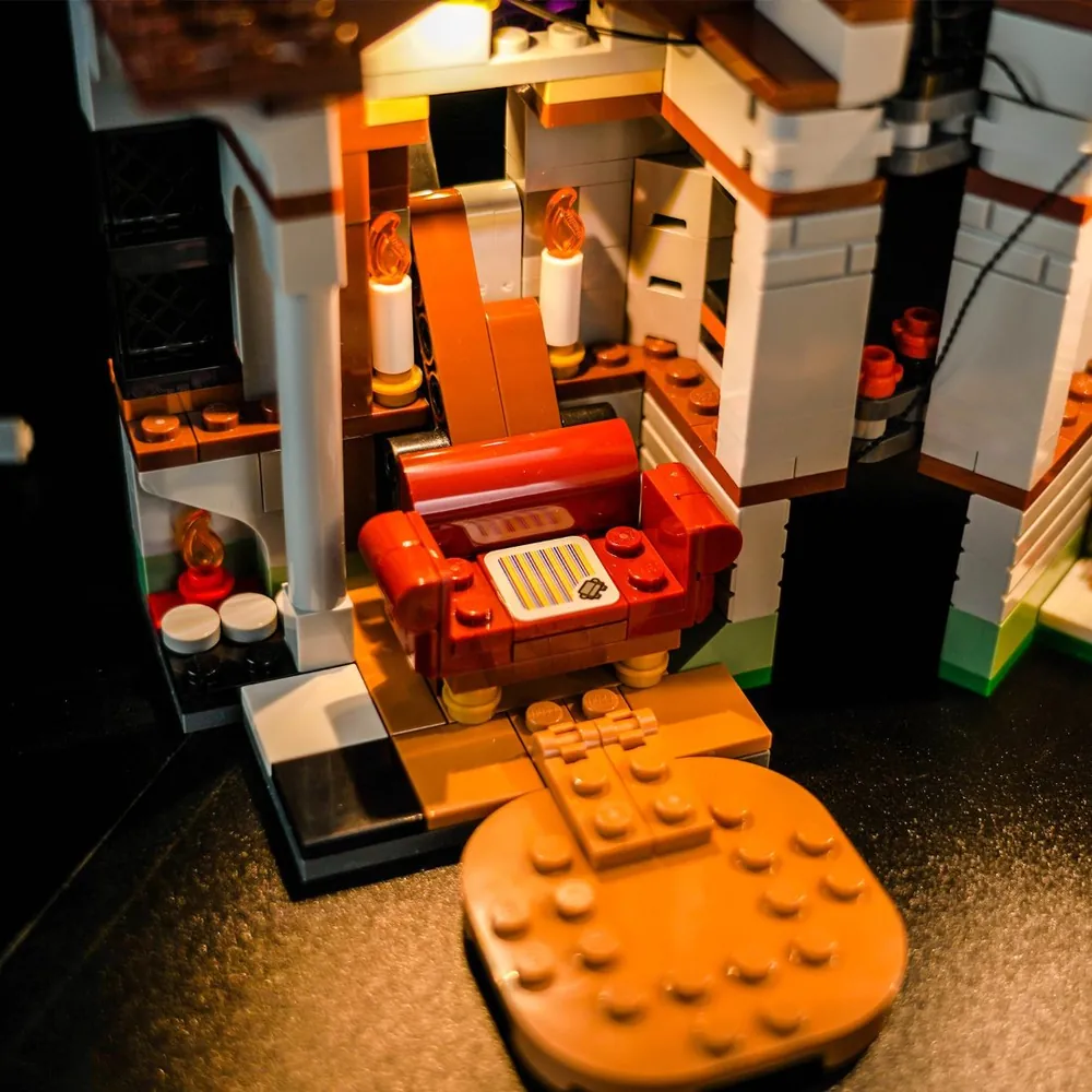 BrickBling kit illuminating the interior details of King Boo's Haunted Mansion, including the armchair and key mechanism