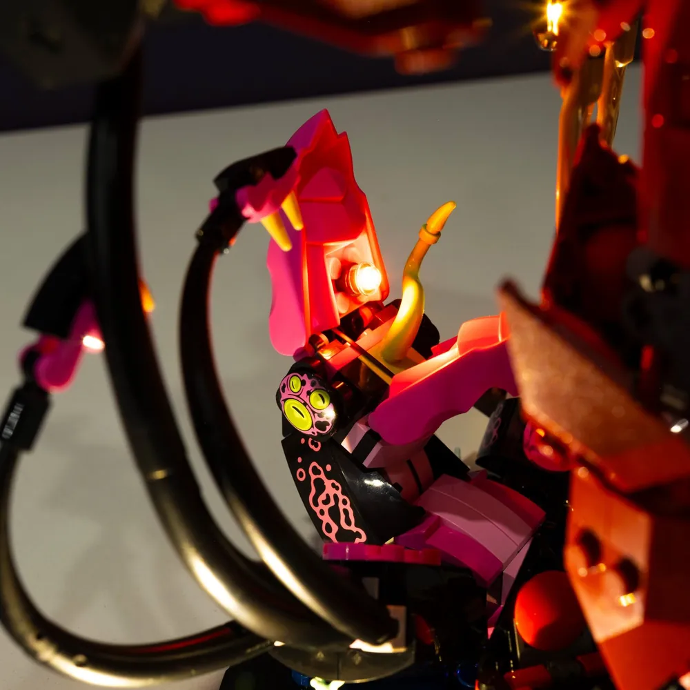 LEGO Fire Knight Mech 71846 lit with LightMyBricks kit showing full mech in dark room