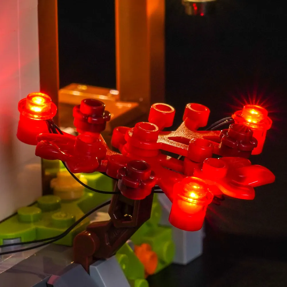 Close-up of BrickBling micro-LED wires on the LEGO Ninjago Blacksmith set, showing discreet wiring and glowing interior details.