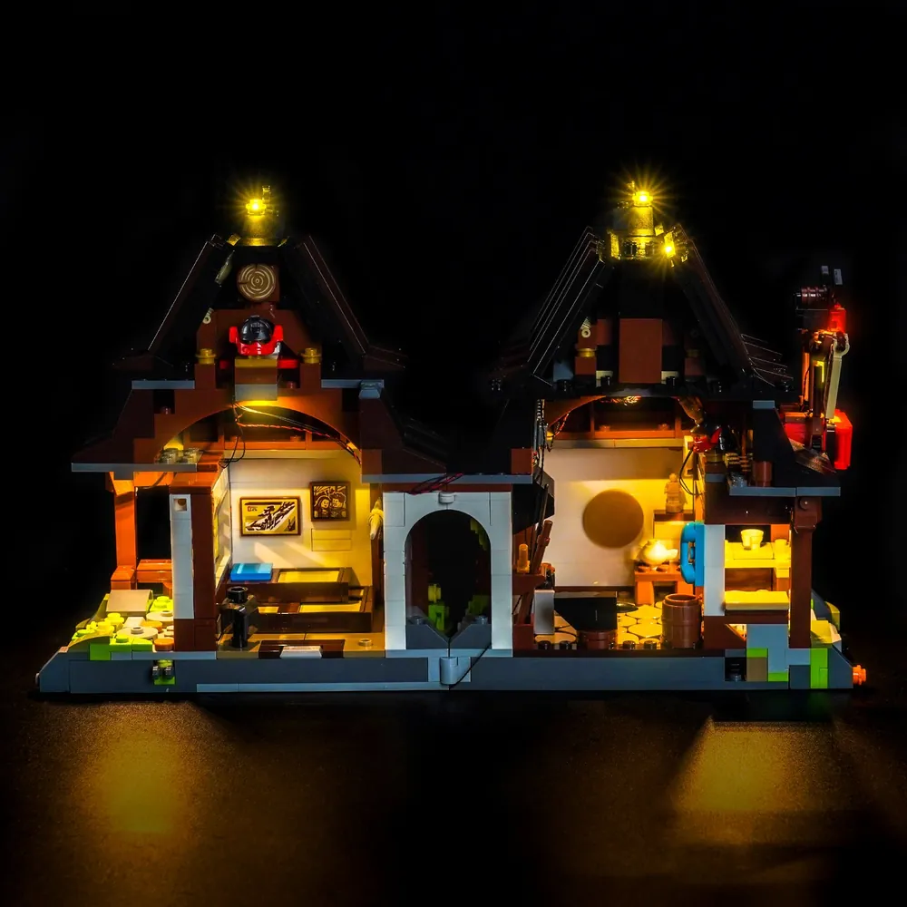 LEGO 71858 Four Weapons Blacksmith with BrickBling remote control variant, showcasing adjustable lighting in a display setting.