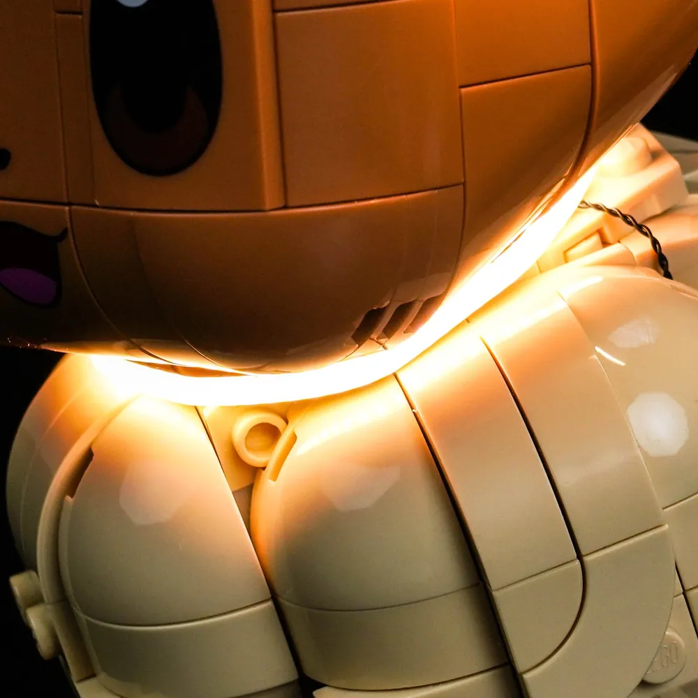 Close-up of BrickBling micro LED wires concealed on LEGO Eevee 72151