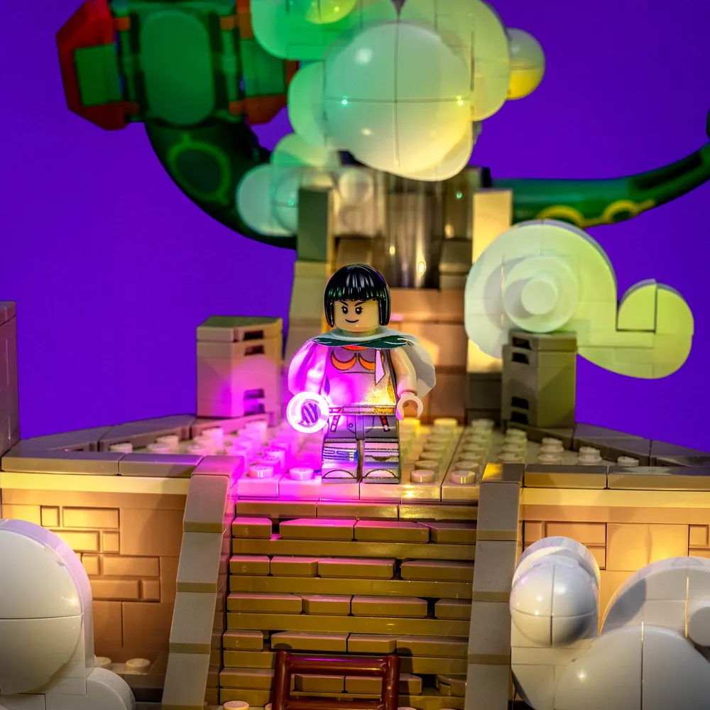 LEGO Rayquaza 72168 display in a dark room, highlighting the illuminated temple and clouds with the lighting kit