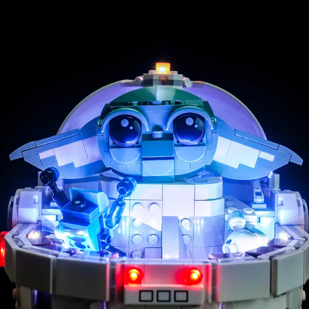 Close-up of BrickBling modular micro-LEDs inside LEGO Grogu pram