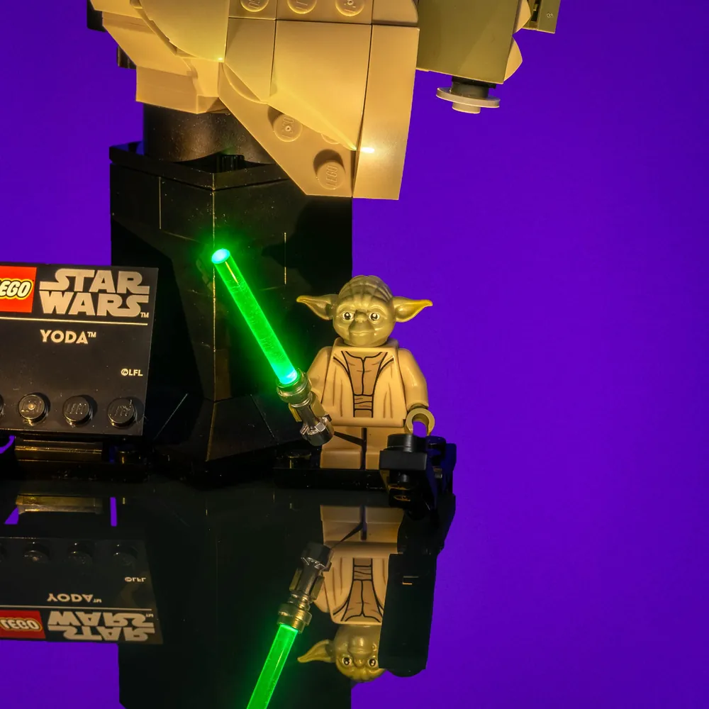 Light My Bricks illuminated Yoda bust in dark room