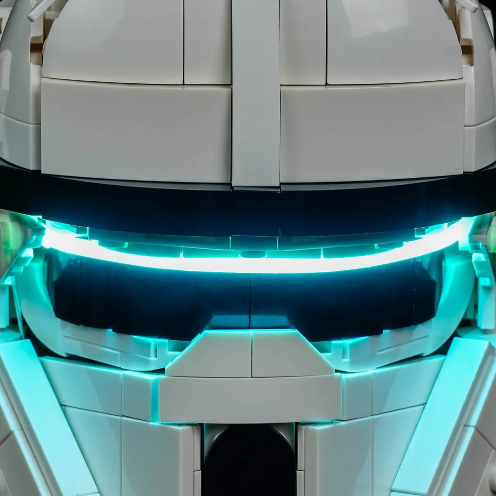 Close-up of BrickBling lighting along the helmet side greebling and visor slit on LEGO 75458