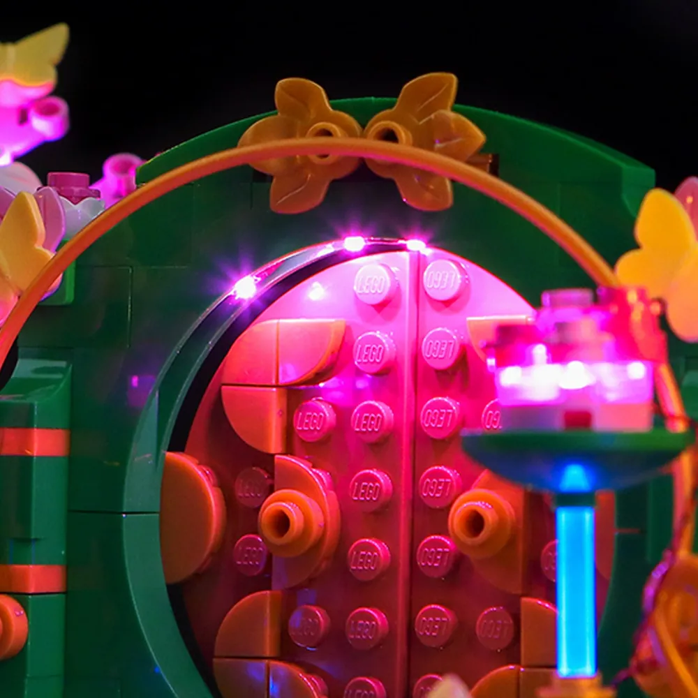 Close-up of BrickBling micro-LEDs placed under the cake and staircase in LEGO 75688