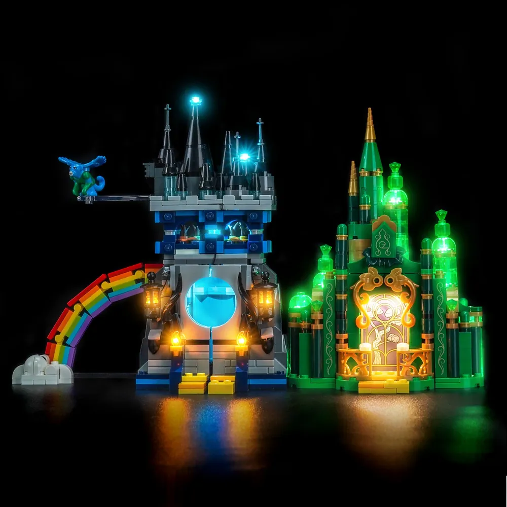 BrickBling modular micro-LED kit for LEGO Emerald City and Kiamo Ko Castle, with spotlights on the green spires and shadows in the dark fortress
