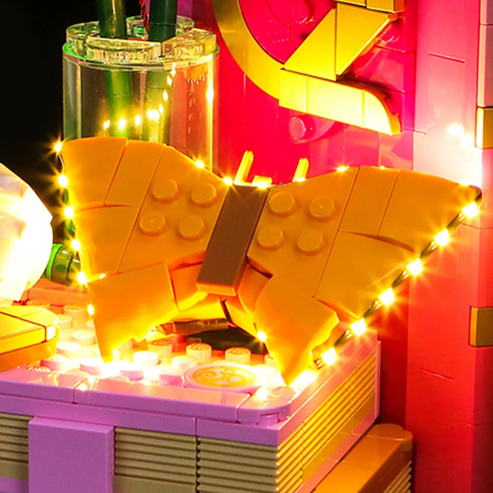 Close-up of BrickBling modular micro-LED harness on LEGO Wicked bookend