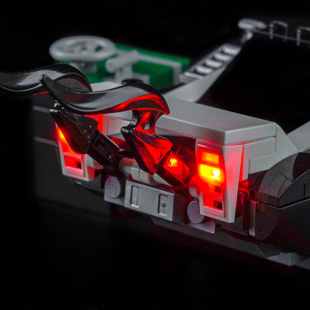 LEGO 76309 Venom Muscle Car illuminated by BrickBling underglow in a dark room