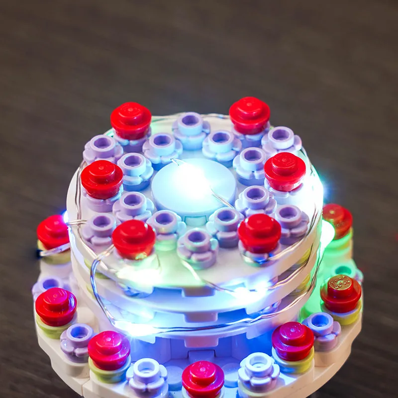 Close-up of BrickBling micro-wires and LEDs on LEGO Dobby's tunic and diary
