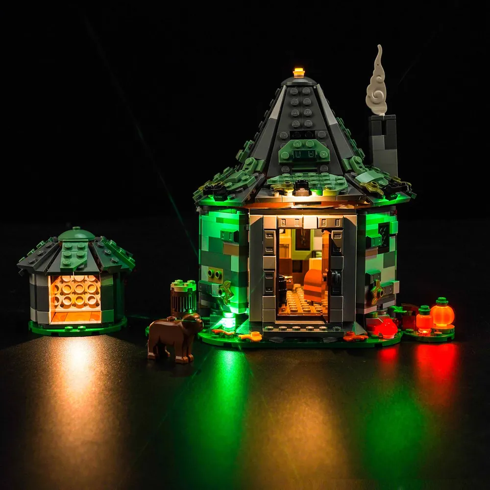 BrickBling light kit for LEGO Hagrid's Hut 76428 with warm LEDs glowing through the windows