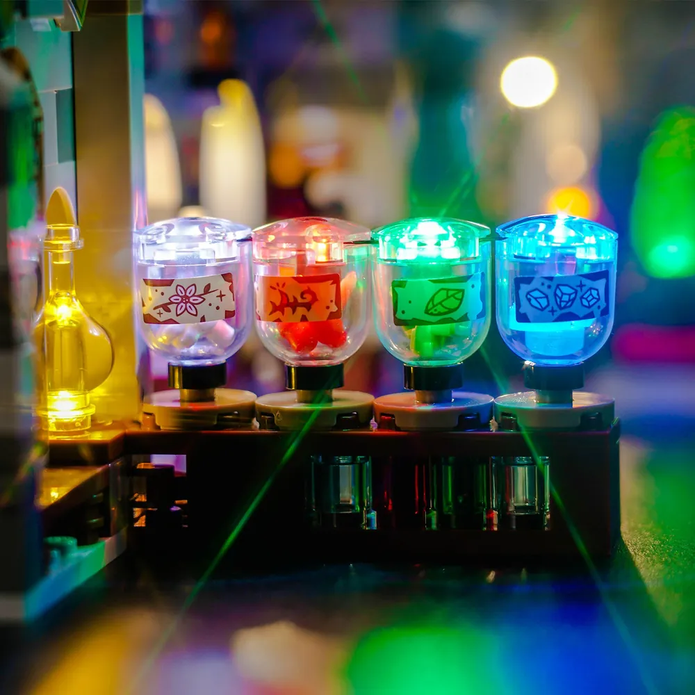 BrickBling micro-LEDs installed on LEGO 76431 Potions Class showing the warm glow on the brick-built archways and ingredients