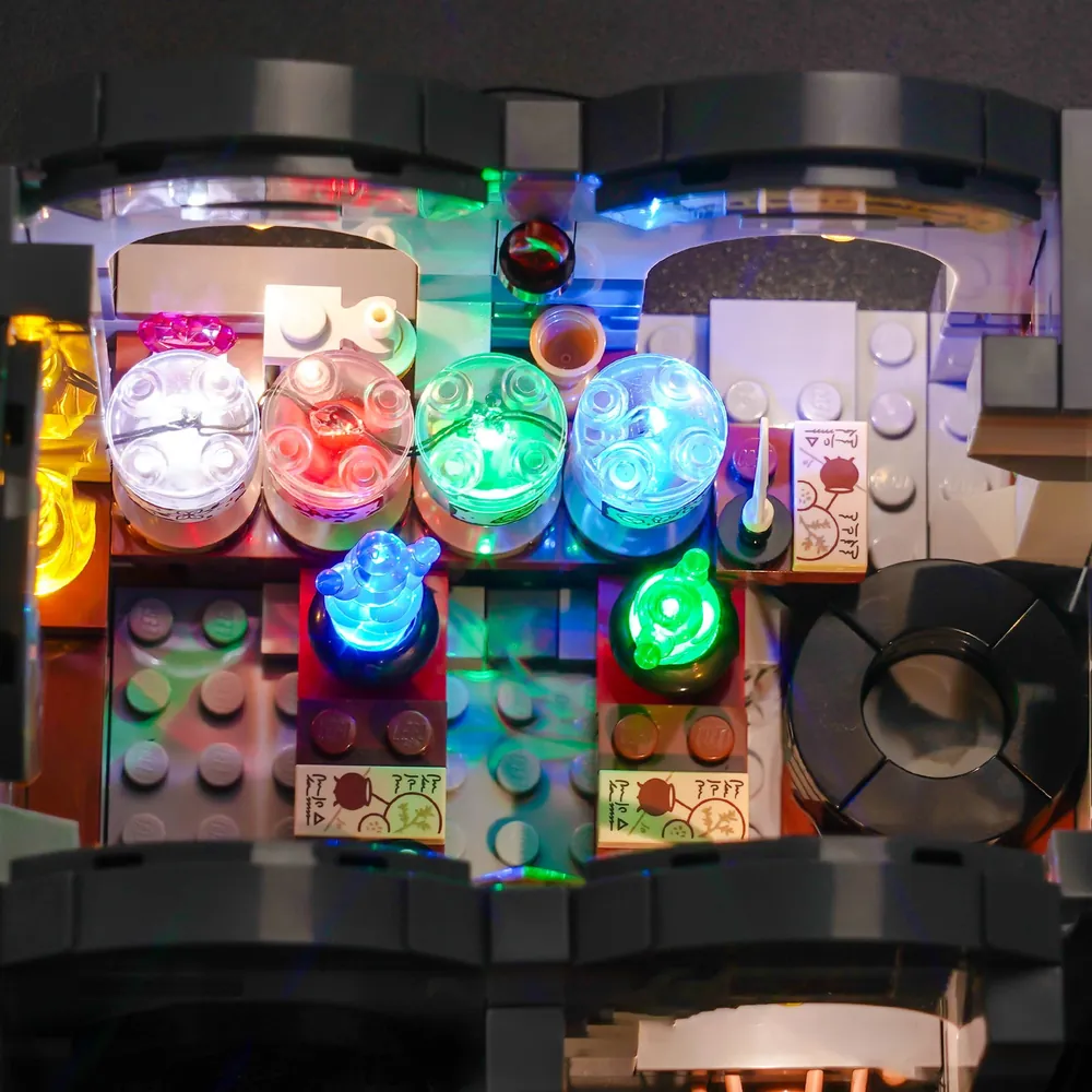 Close-up of BrickBling LED kit on LEGO 76431 Potions Class showing the modular micro-LEDs and hidden wiring