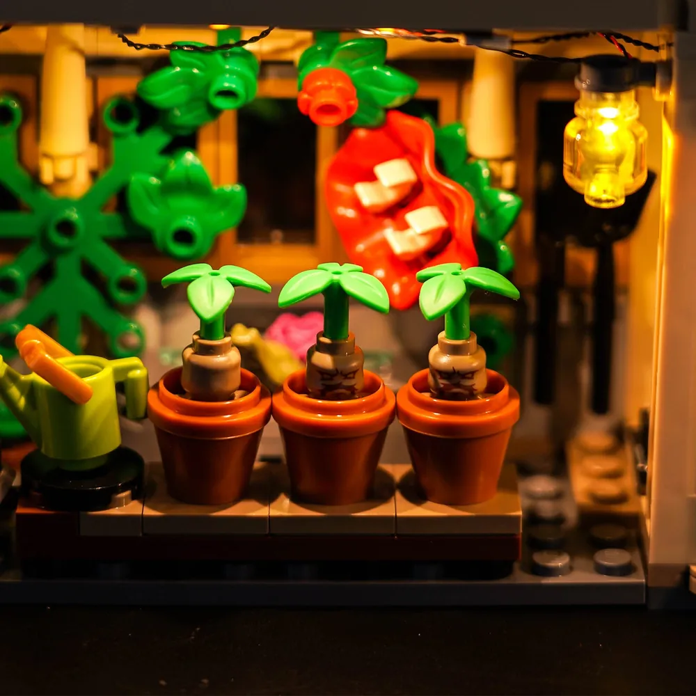 Close-up of BrickBling micro-LEDs on the potting table and mandrakes in LEGO 76445