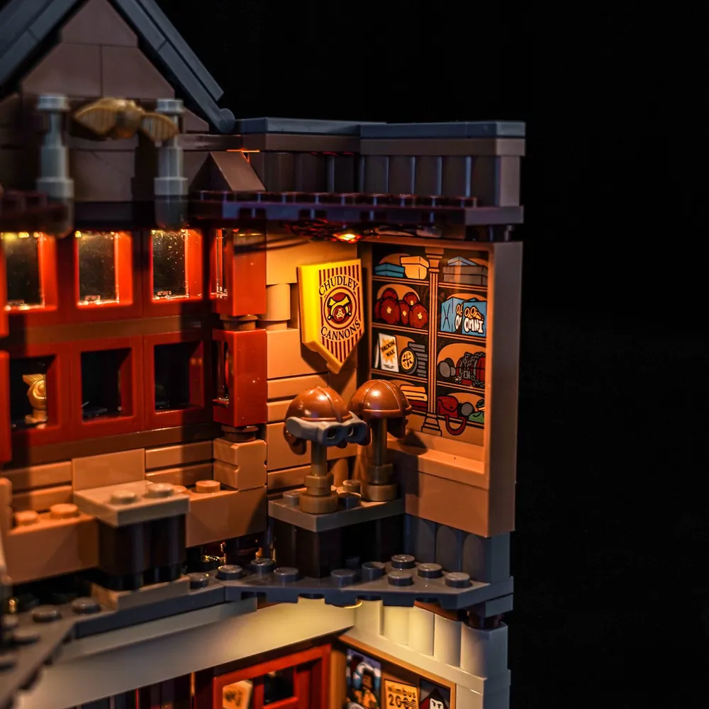 Close-up of BrickBling modular micro-LEDs highlighting the ice cream parlor facade and window display on LEGO 76452