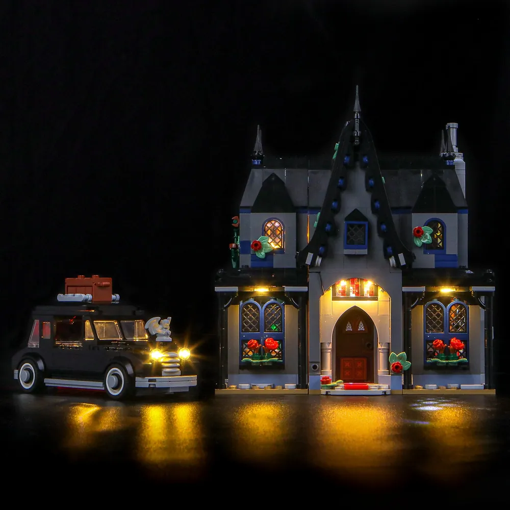 BrickBling LED kit illuminating the fireplace and crystal ball in LEGO Morticia's Cottage 76786