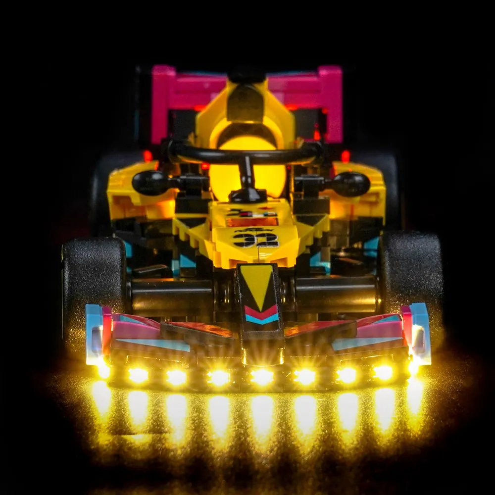 Aerial view of the LEGO F1 Academy car with glowing side pods and rear wing under BrickBling lights