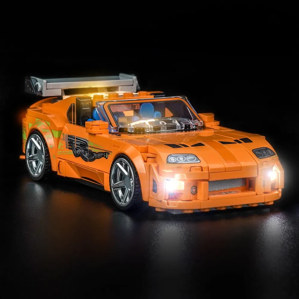 BrickBling LED kit for LEGO Speed Champions Toyota Supra MK4 emphasizing headlights and tail lights with modular micro-wires