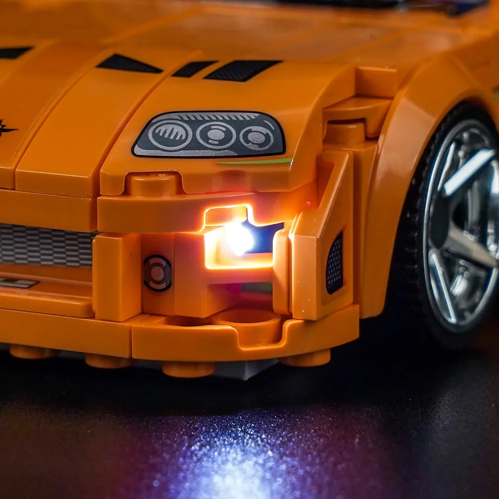 BrickBling kit wiring detail on LEGO Supra MK4 showing micro-LED concealment