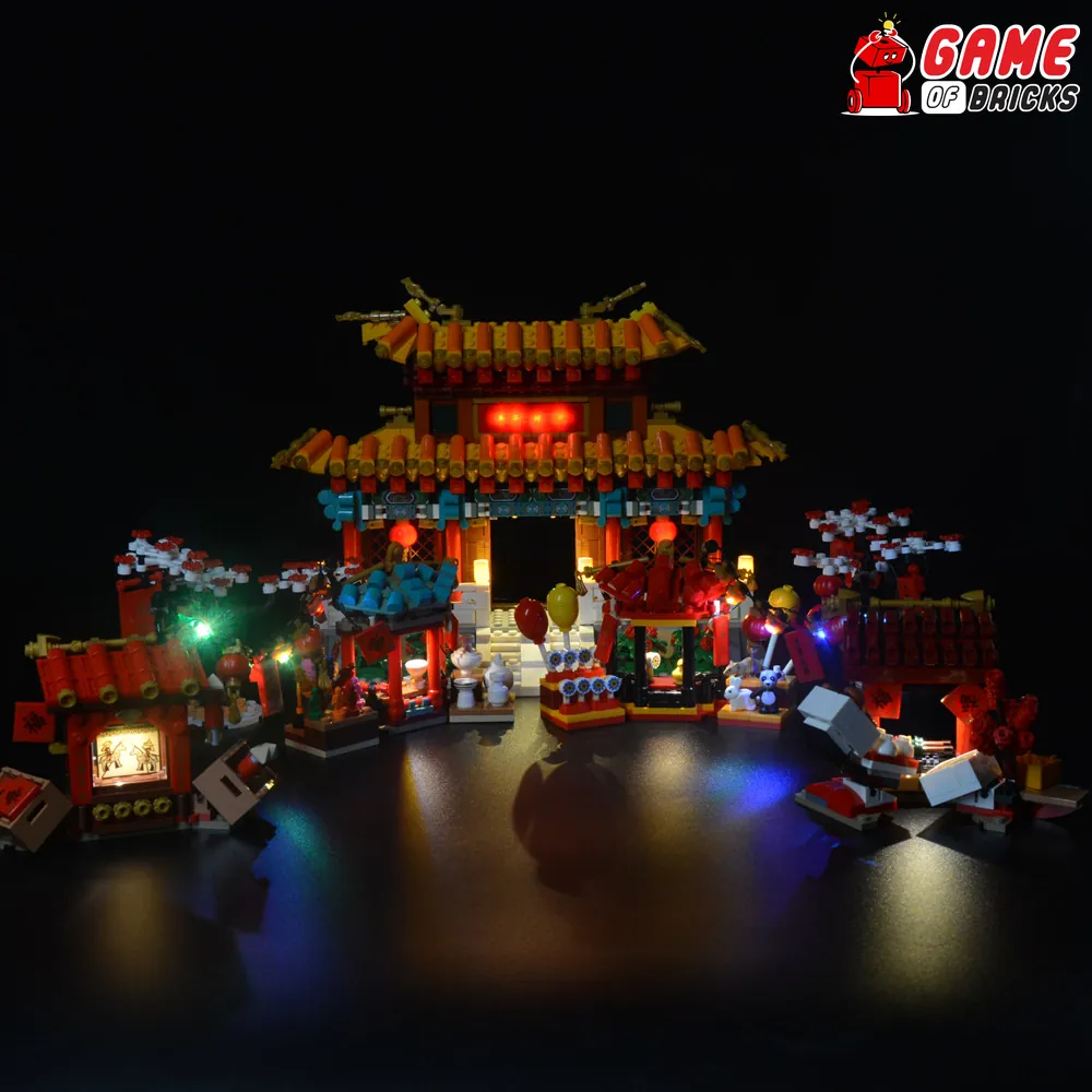 Game of Bricks LED kit lighting up the LEGO 80105 Temple Fair central gate and stalls