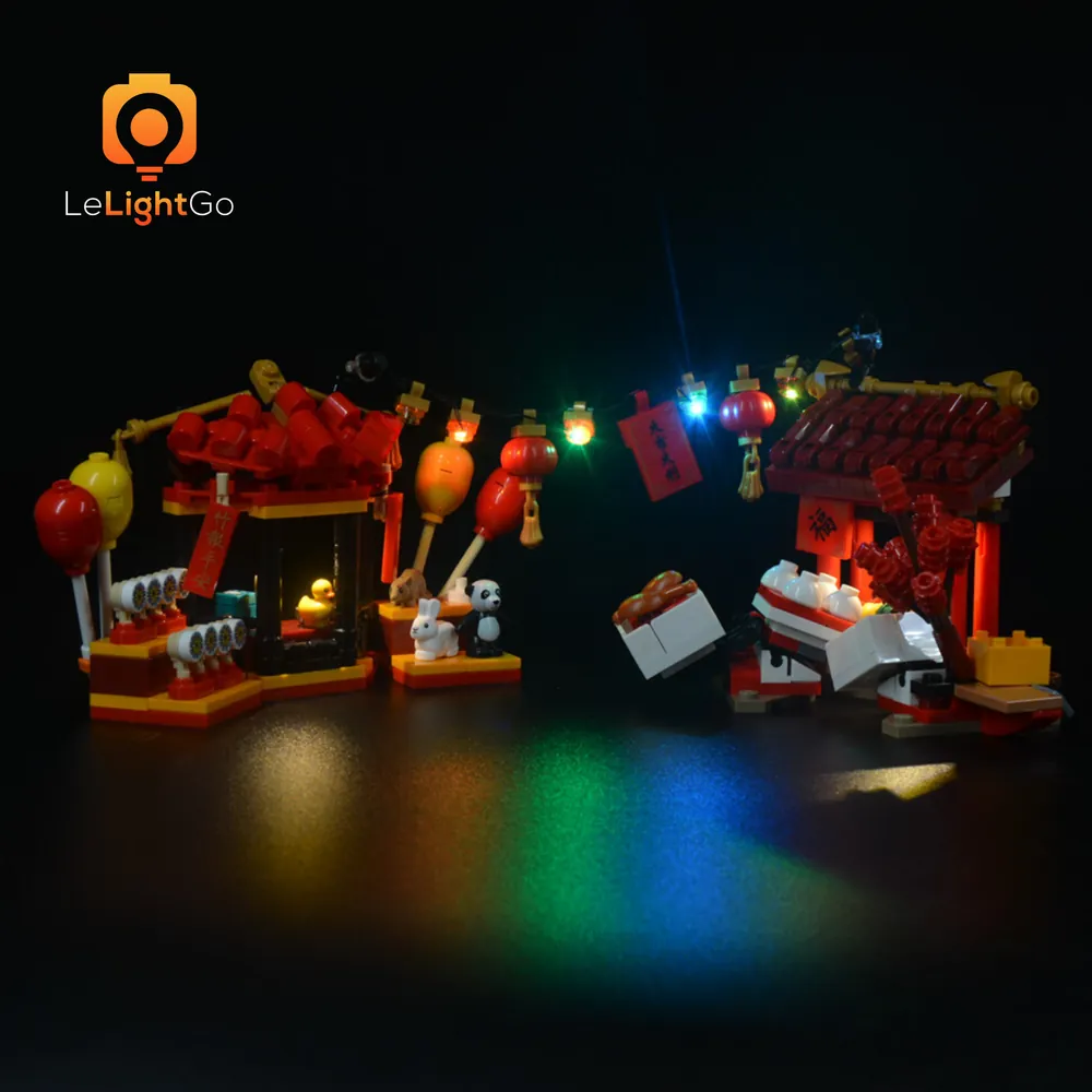 LEGO 80105 Temple Fair lit with LeLightGo lights showing warm glow