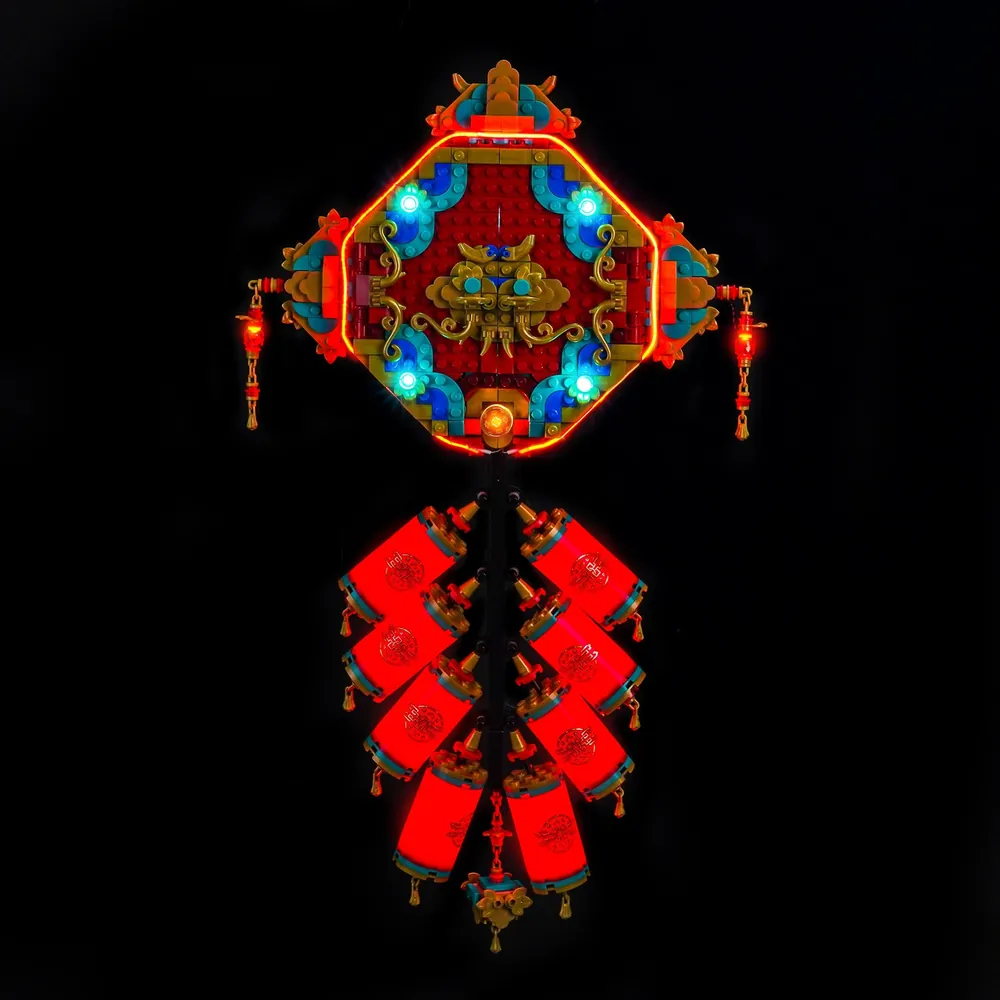BrickBling LED kit lighting up LEGO Fortune Firecracker 80118 with warm glow on gold details