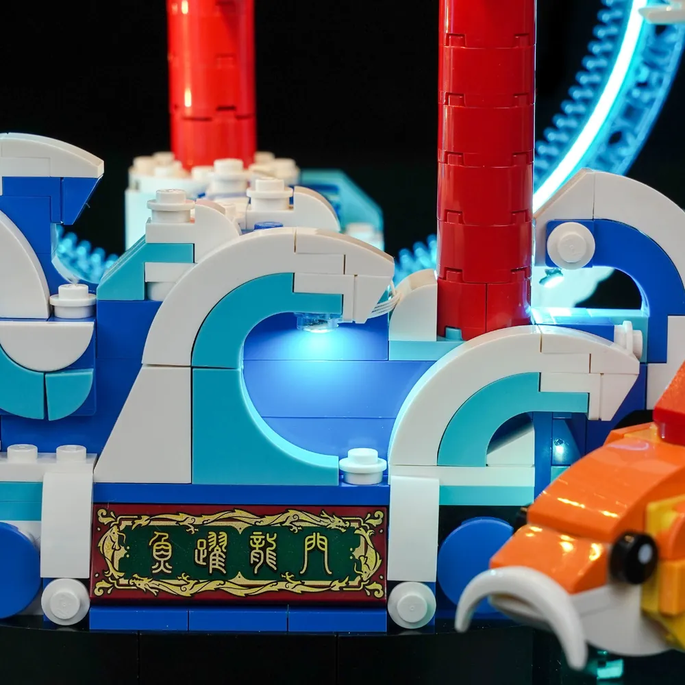Close-up of BrickBling LED lights on LEGO Prosperity Carp Leaping showing micro-LEDs and wiring
