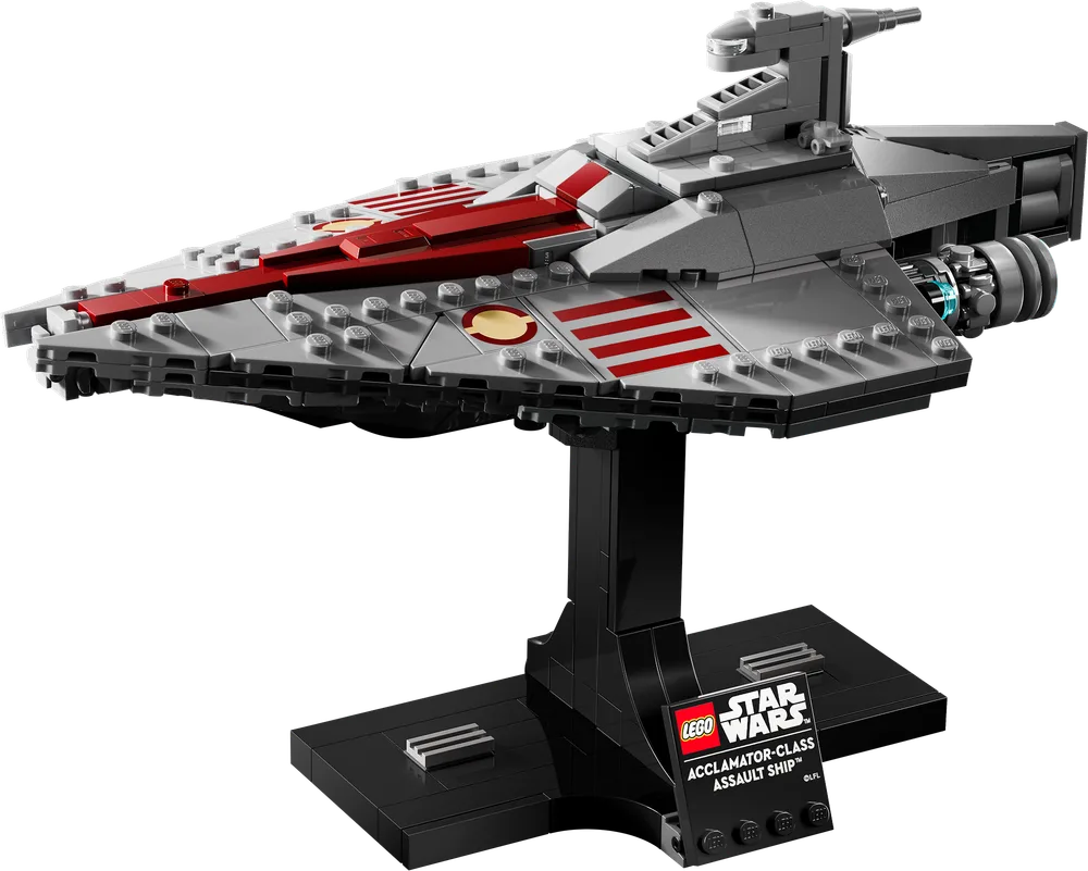 LEGO Star Wars Acclamator-Class Assault Ship set 75404 on display stand, angled front view. It's mostly light grey with dark red stripes on the wedge-shaped hull and blue trans-clear engine elements.