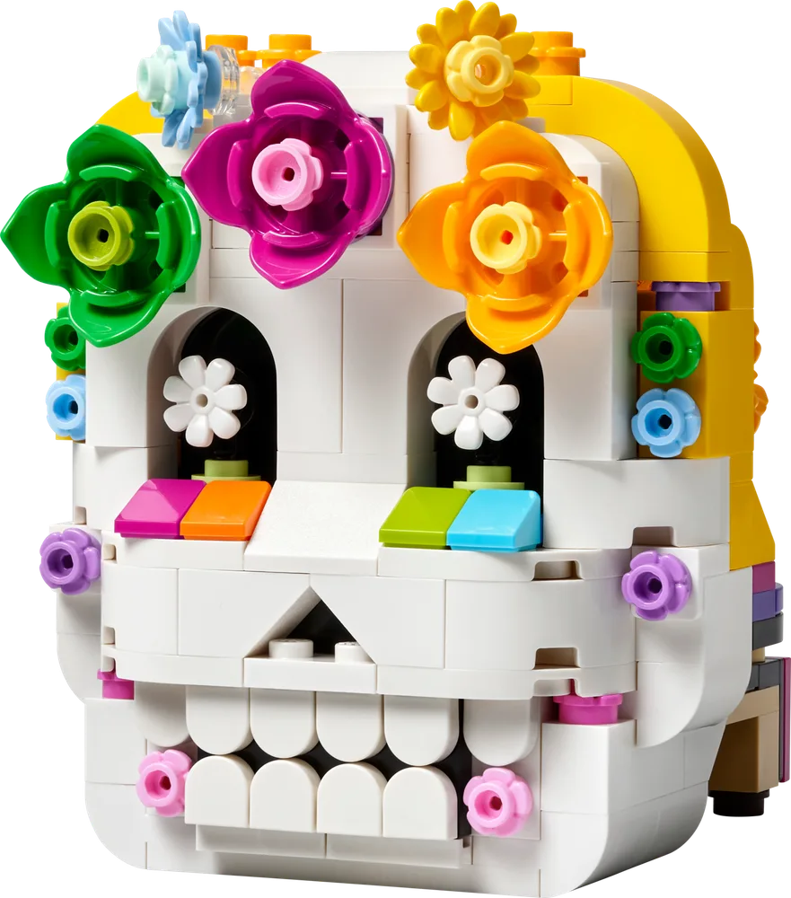 Front view of the LEGO Altar of the Dead skull, adorned with colorful flowers.