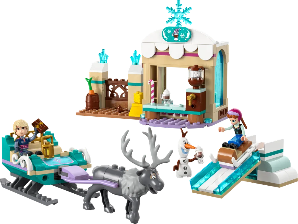 Full LEGO Disney Frozen set 43256 showing Kristoff in a teal sleigh pulled by Sven, Anna on a white sled on a blue ramp, and Olaf near a tan cocoa stall with a snowflake sign, all on a white background.