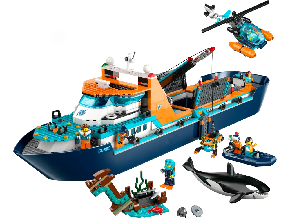 A complete overview of the LEGO City Arctic Explorer Ship set, showcasing the large dark blue and orange exploration vessel, a small helicopter, a dinghy, an ROV, a shipwreck, an orca, and several minifigures.