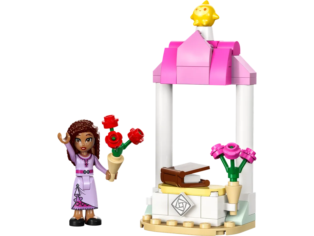 Asha minifigure stands beside a small, pink-roofed white booth holding a cone of red flowers, with yellow Star on the roof.