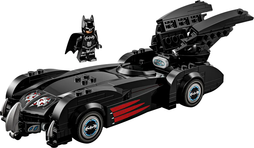 Front 3/4 view of the LEGO Batman & Robin Batmobile with a Batman minifigure standing beside it, showcasing its sleek black design and prominent rear fins.
