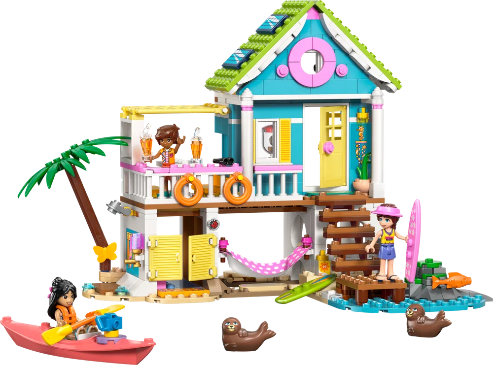 LEGO Friends Beach House 42699 with two minifigures, a kayak, and two seals.