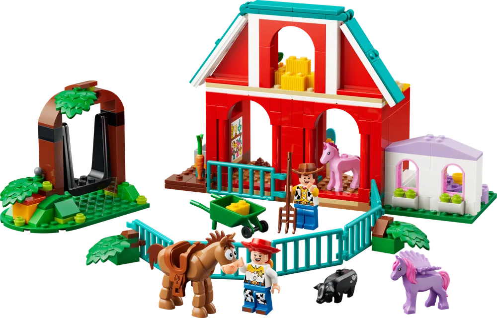 Full LEGO Disney Toy Story 43304 Blaze's Horse Ranch set with barn, archway, minifigures Woody and Jessie, and animals Bullseye, Ham, and two unicorns.