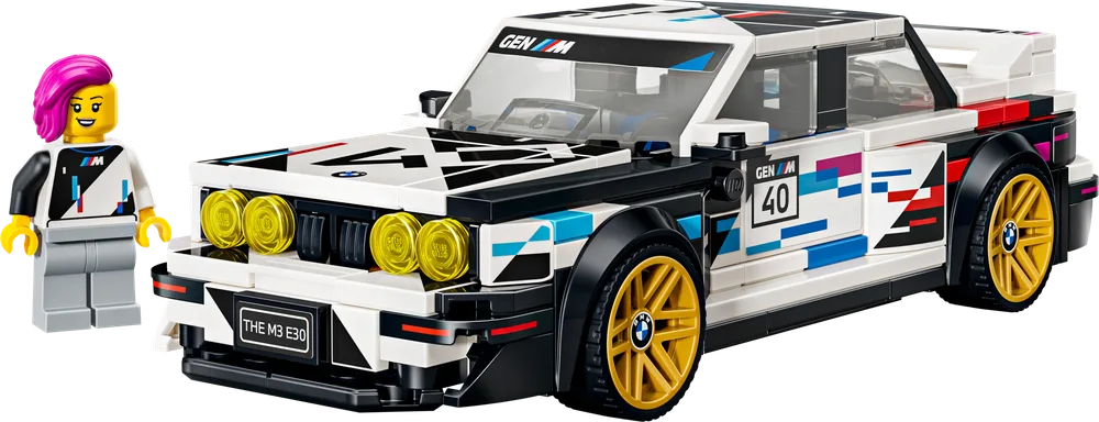 Front 3/4 view of the LEGO Speed Champions BMW M3 (E30) with its driver minifigure, showcasing the detailed M Motorsport livery and yellow rally-style headlights.